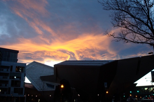 The sky glowed for a moment about the Denver Art Museum